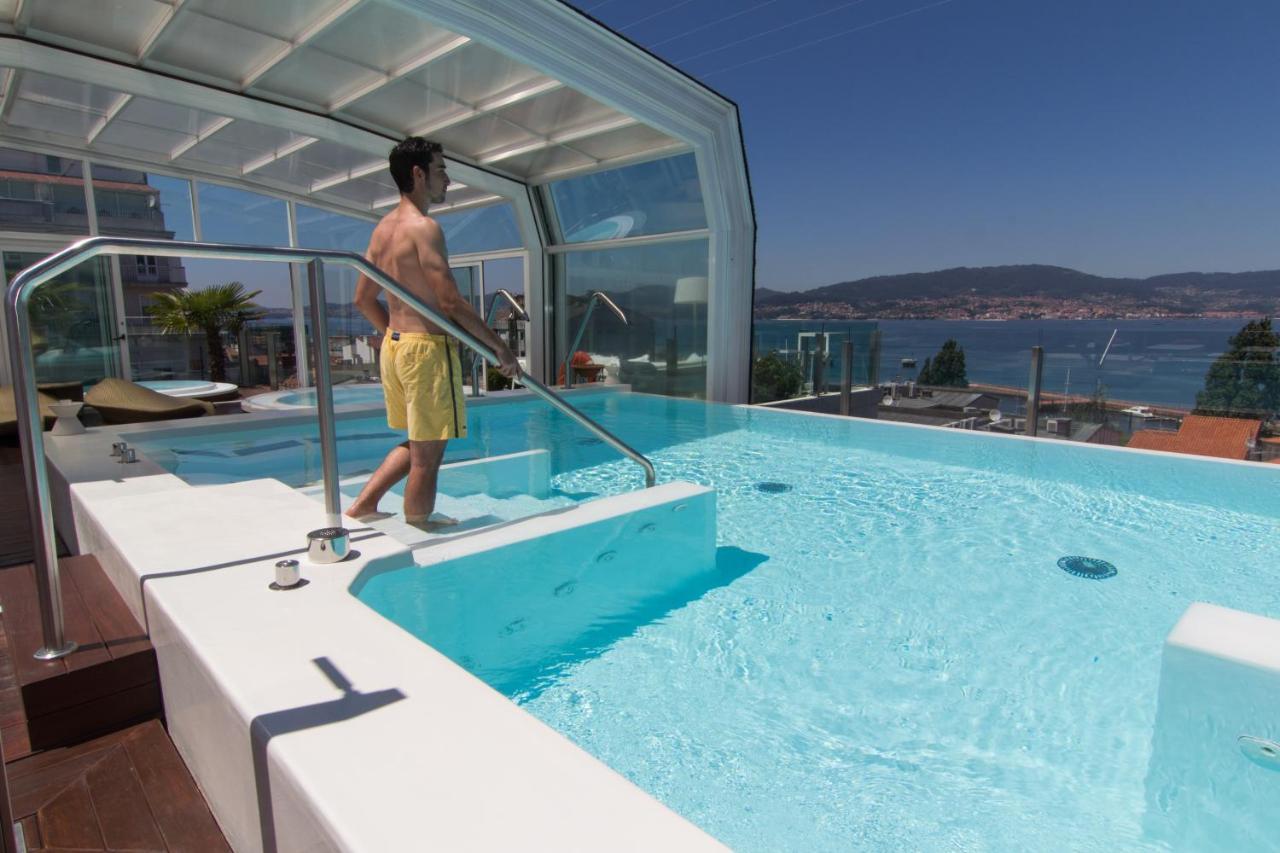 纳加里精品水疗大酒店 比戈 外观 照片 A pool enclosure